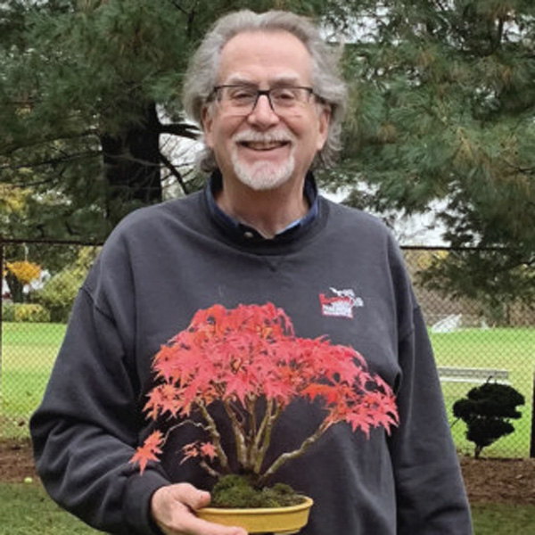Mark Arpag holding Japanese maple bonsai